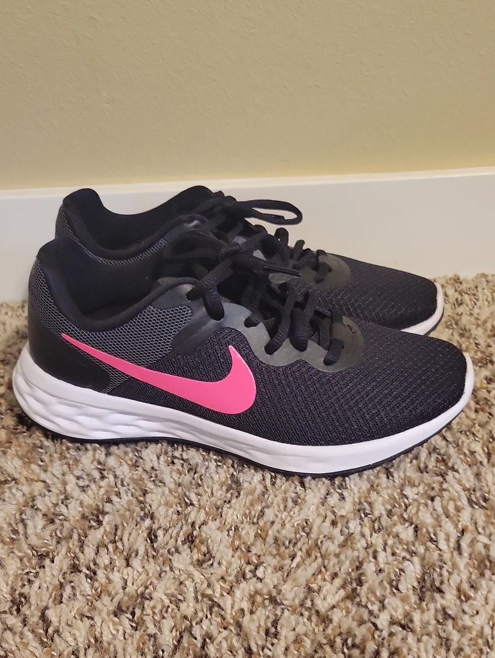 Nike Women's Black Running Shoes with Pink Swoosh